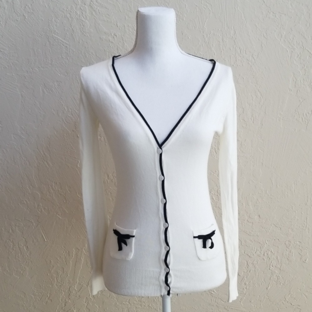 White cardigan with cute bow accents!